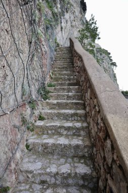 Anacapri, Campania, Italy - March 12, 2022: Glimpse of the Phoenician Staircase that from the Church of San Costanzo climbs up to Villa San Michele