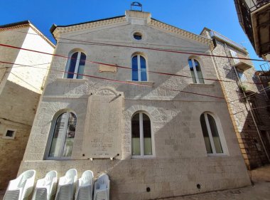 Ferrazzano, Molise, Italy - July 13, 2022: Memorial plaque to the Fallen on the facade of the nineteenth-century Palazzo Reale-Fazio in Piazza De Sanctis
