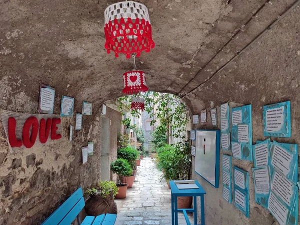 Oratino, Molise, Italy - July 13, 2022: Glimpse of the Vicolo del Bacio from Via Vittorio Emanuele