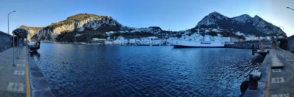 Capri, Campania, Italy - March 13, 2022: Panoramic photo of the Marina Grande port at sunset