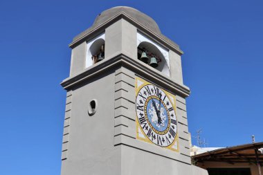 Capri, Campania, Italy - March 11, 2022: 17th-century bell tower, also known as the Clock Tower, overlooking the square