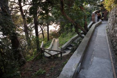 Capri, Campania, Italy - March 11, 2022: Section of the Via Pizzolungo path that connects Via Arco Naturale with the Belvedere Tragara along the faraglioni