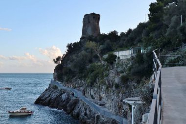 Praiano, Campania, Italy - October 1, 2022: 13th century Asciola tower in Marina di Praia clipart