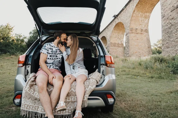 Middle Aged Couple Sitting Trunk Suv Car Viaduct Bridge Background — 스톡 사진
