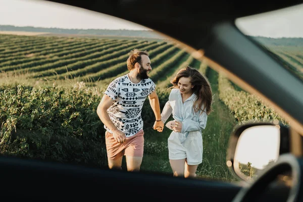 View Car Window Happy Middle Aged Couple Running Beautiful Fields — 스톡 사진