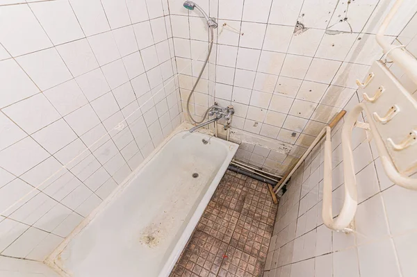 Russia, Moscow- May 19, 2020: interior apartment room bathroom, sink, decorative elements, dilapidated old sloppy not modern furnishings. cosmetic repair required