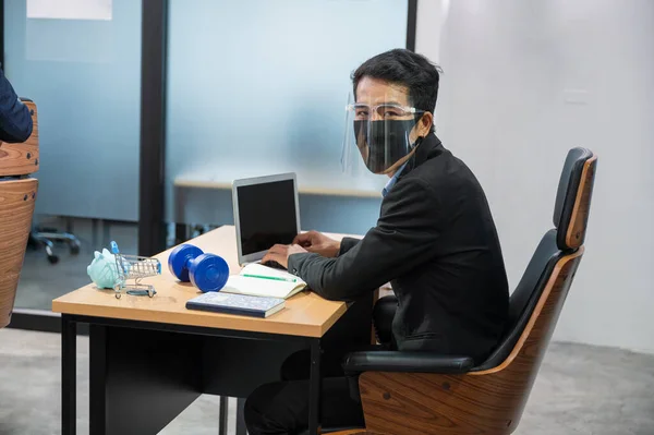 Young Asian Businessman Wearing Face Shield Looking Camera Working Laptop — Stock Photo, Image