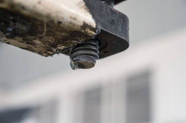 Dirty thread of the car lift machine with grease in garage workshop