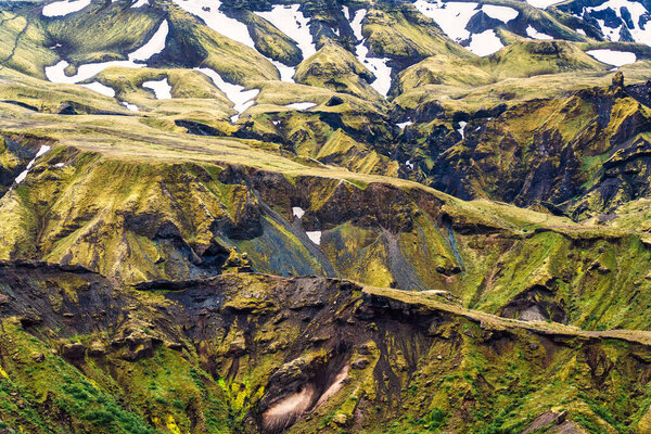 Close up surface of weathered rugged icelandic mountain on summer in highlands of Iceland