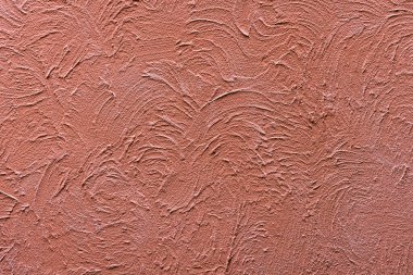 Soyut engebeli turuncu alçı duvar dokusu arka planı