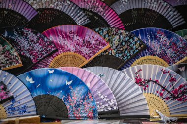 Colourful souvenir fans for sale on the street in the Muslim Quarter, Xian town, China