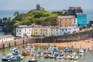 Tenby, Wales - May 2021 : Port and marina in the beautiful little town called Tenby in Pembrokeshire, Carmarthen Bay, Wales, Great Britain
