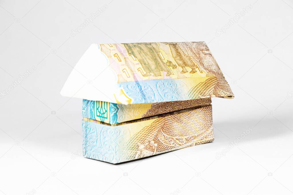 a house made from a paper bill of the ukrainian hryvnia