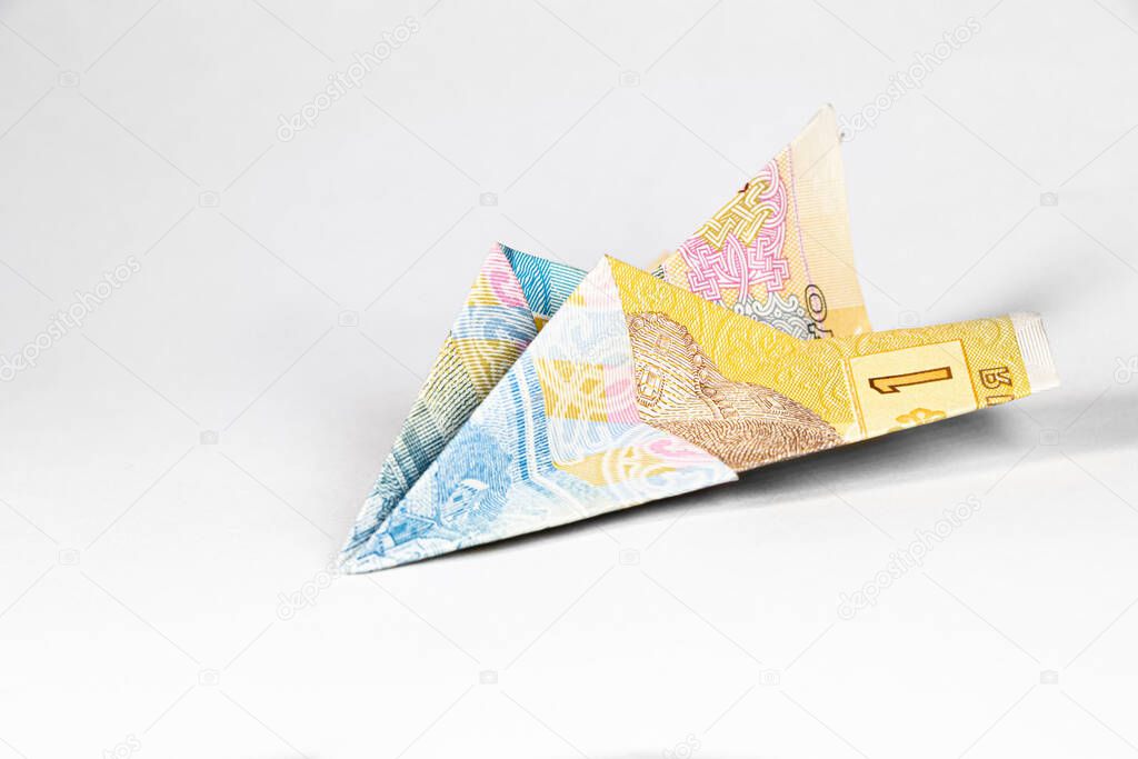 An airplane made from a paper bill of the Ukrainian hryvnia