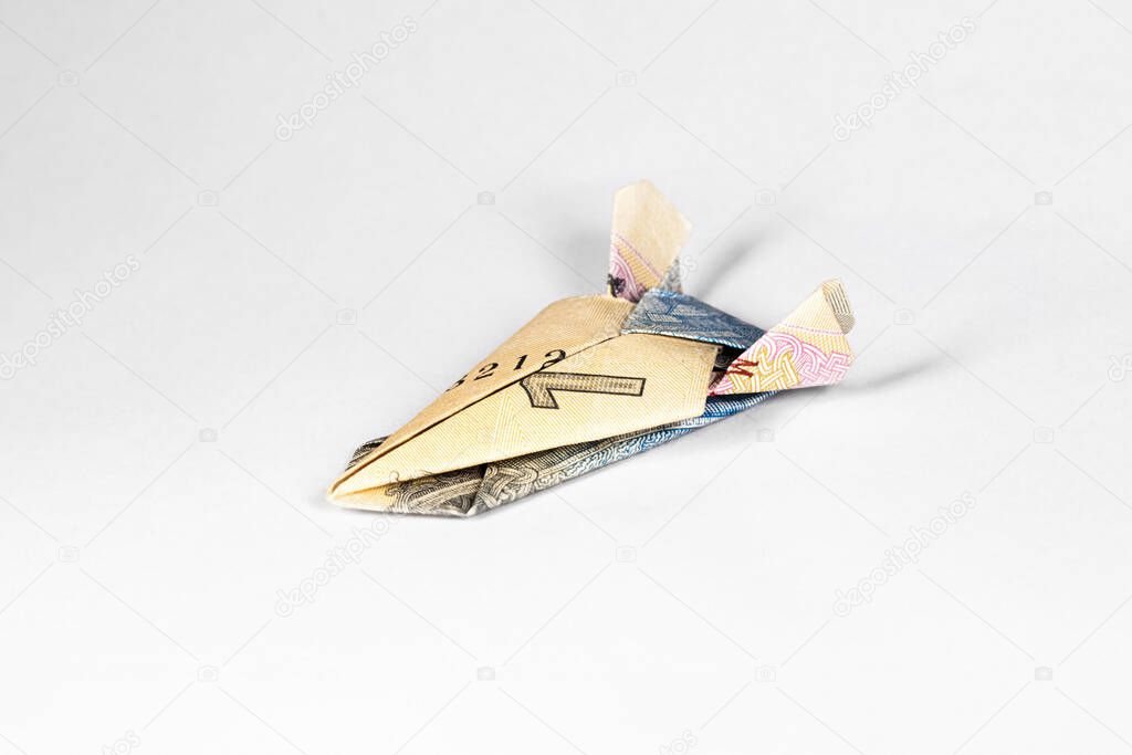 a star ship made of a paper note of the Ukrainian hryvnia