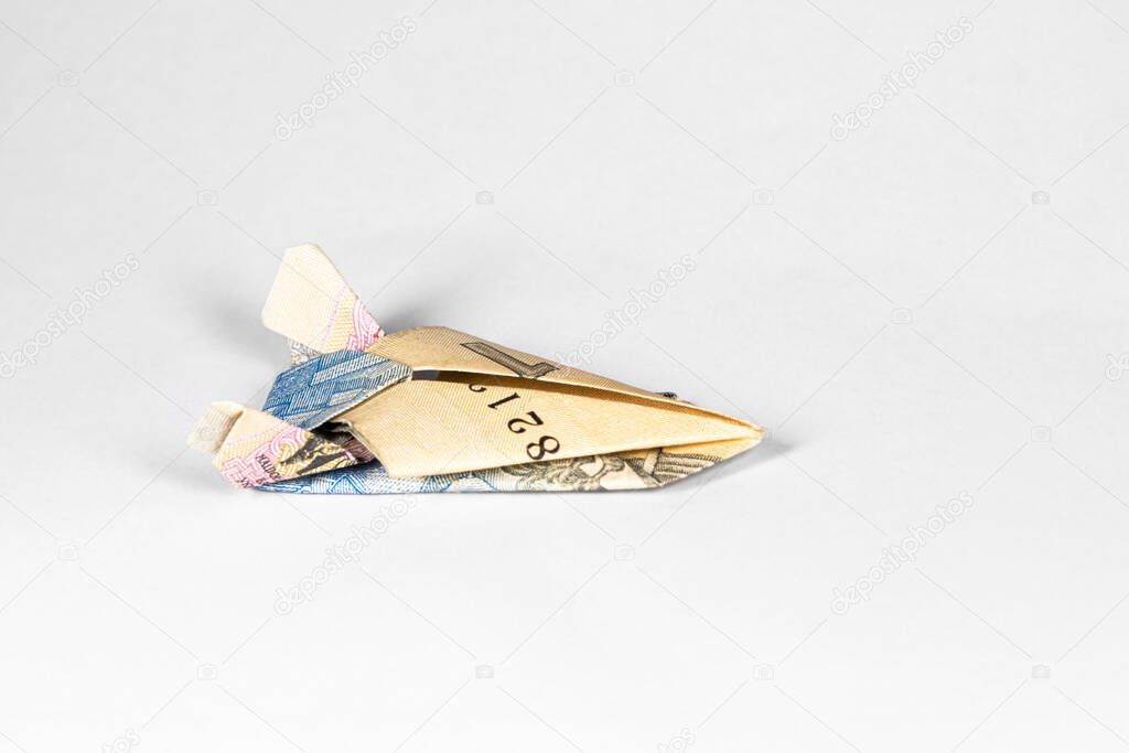 a star ship made of a paper note of the Ukrainian hryvnia