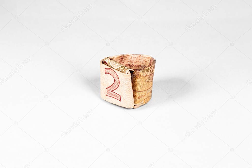 ring of monetary omnipotence made from a paper bill of the Ukrainian hryvnia
