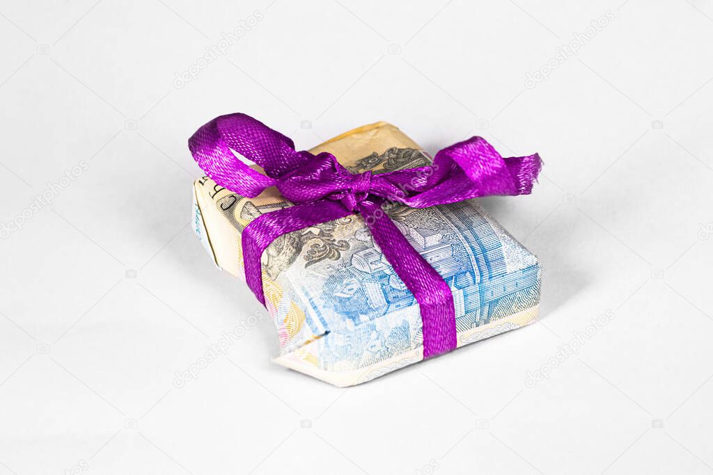 gift in a box made from a paper bill of the Ukrainian hryvnia
