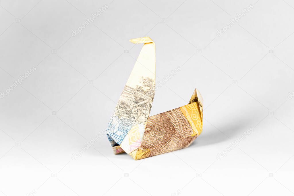 swan made from a paper bill of the Ukrainian hryvnia