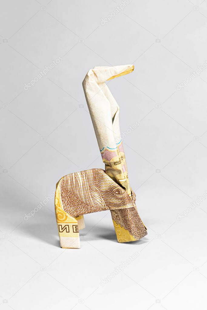 giraffe made from a paper bill of the Ukrainian hryvnia