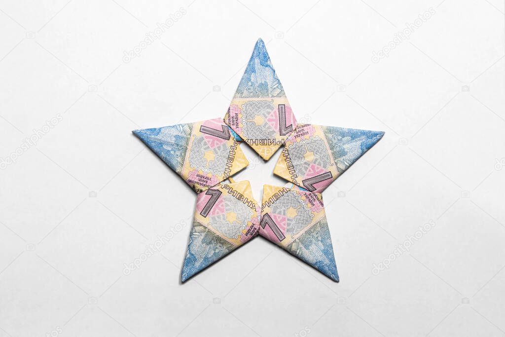 Star made from a paper bill of the Ukrainian hryvnia