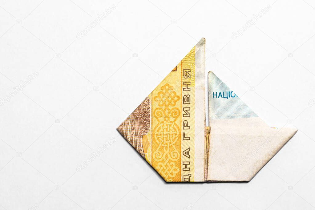 sailboat made from a paper bill of the Ukrainian hryvnia