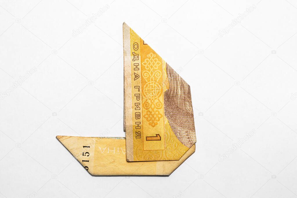 sailboat made from a paper bill of the Ukrainian hryvnia