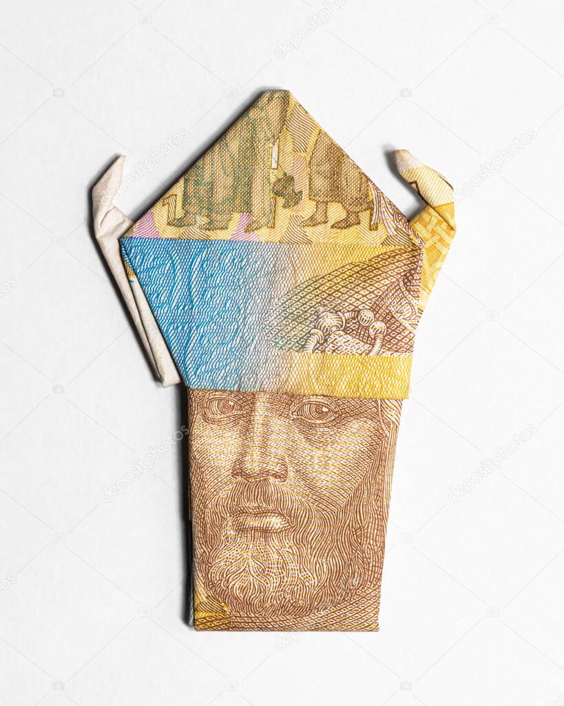 Vladimir the Great in a helmet made from a paper bill of the Ukrainian hryvnia