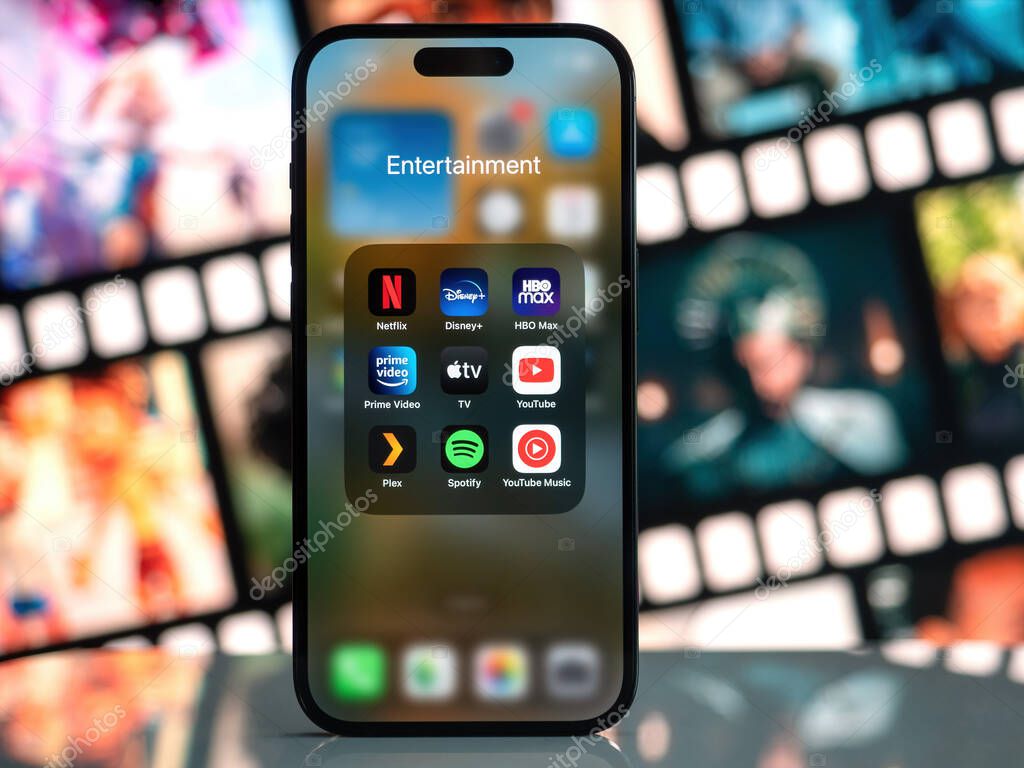 Galati, Romania - October, 03 2022: Mobile app icons of entertainment services are seen on a smartphone, including Netflix, Disney+, HBO Max, Amazon Prime Video, Apple TV, Youtube, Plex, Spotify.