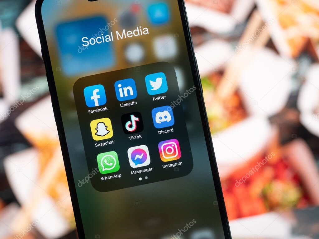 Galati, Romania - October, 03 2022: Mobile app icons of social media services are seen on a smartphone, including Facebook, LinkedIn, Twitter, Snapchat, TikTok, Discord, WhatsApp, Messenger, Instagram.
