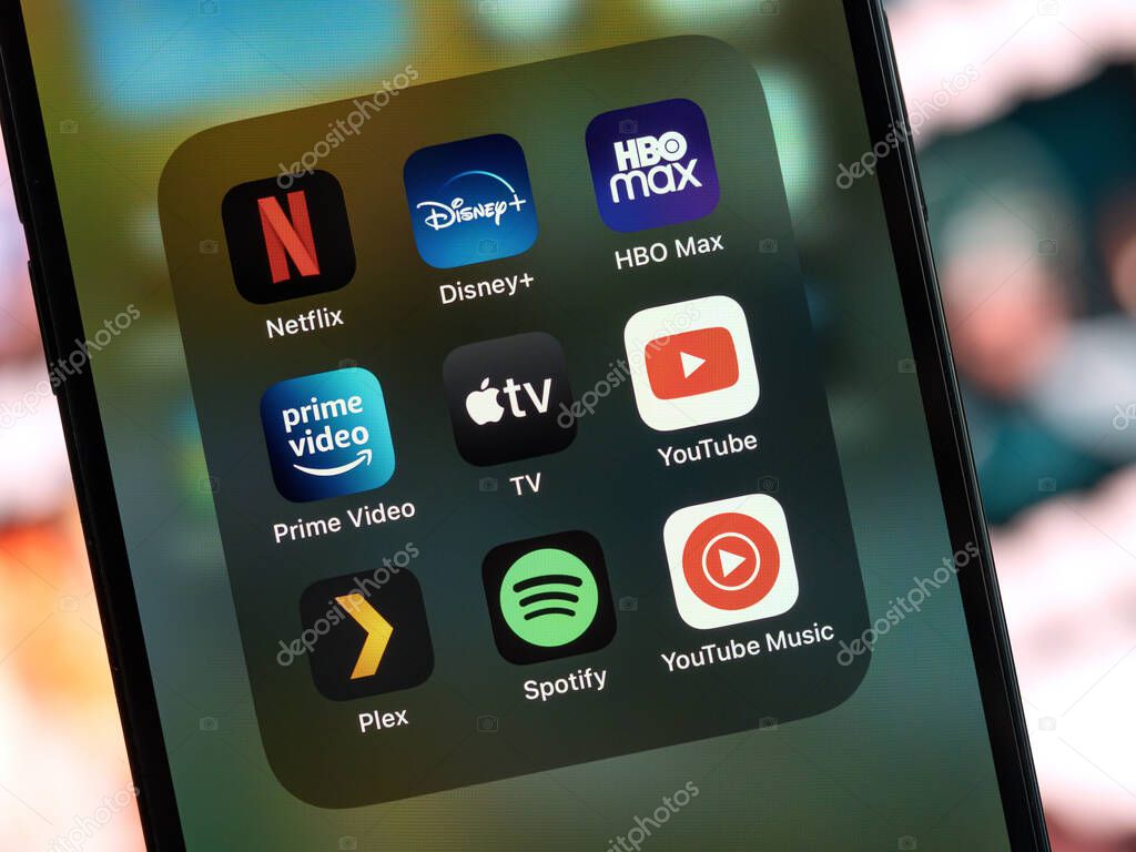 Galati, Romania - October, 03 2022: Mobile app icons of entertainment services are seen on a smartphone, including Netflix, Disney+, HBO Max, Amazon Prime Video, Apple TV, Youtube, Plex, Spotify.