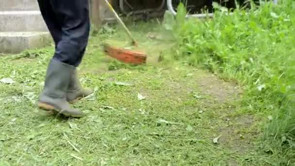 Man Rubber Boots Mows Green Grass House Overgrown Rain Householder — Stockvideo
