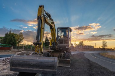 An excavator at road repair works