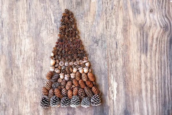 Christmas Tree Made Natural Details Cones Acorns Rough Wooden Background — Stock fotografie