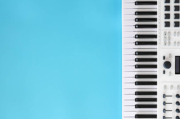 Music keys on blue background, top view, flat lay, copy space.