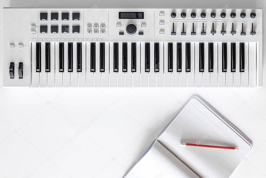 Musical background with musical keys on white, flat lay, copy space.