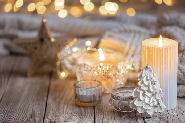 Christmas background with burning candle and decor details. — Stock Photo, Image