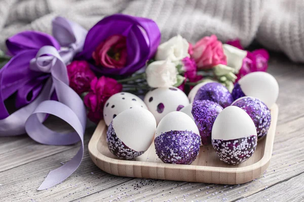 Close-up of Easter eggs decorated with purple sparkles. Royalty Free Stock Images