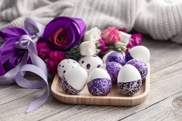 Close-up of Easter eggs decorated with purple sparkles. Royalty Free Stock Images
