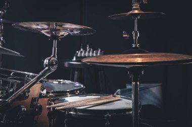 Close-up, part of a drum kit on a blurred background.