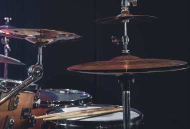 Close-up, part of a drum kit on a blurred background.