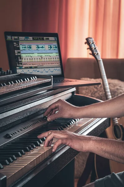 A man composer, producer, arranger, songwriter, musician hands arranging music. — Stok fotoğraf