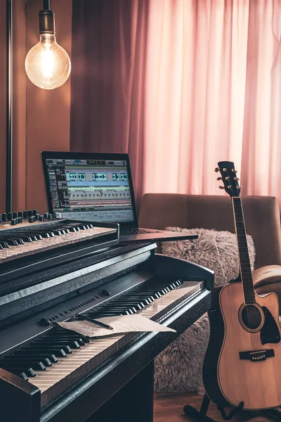 Electronic piano in the interior of the room on a blurred background.