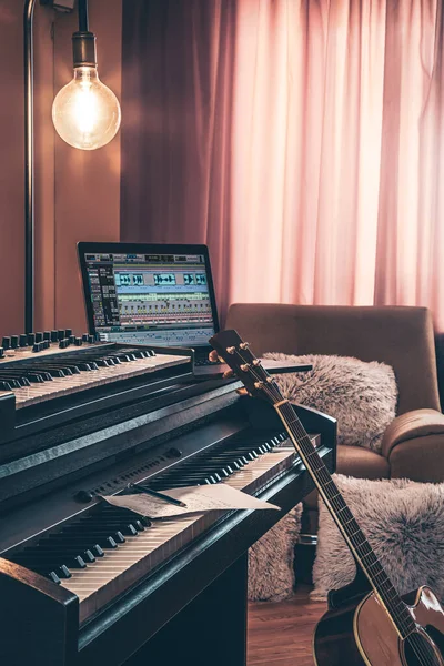 Electronic piano in the interior of the room on a blurred background.