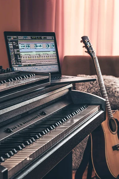 Electronic piano in the interior of the room on a blurred background.