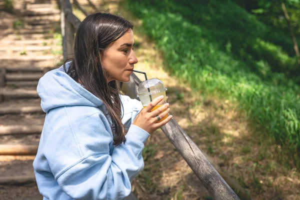 Young Woman Drinking Juice Straw Park Summer Walk Concept — Stockfoto