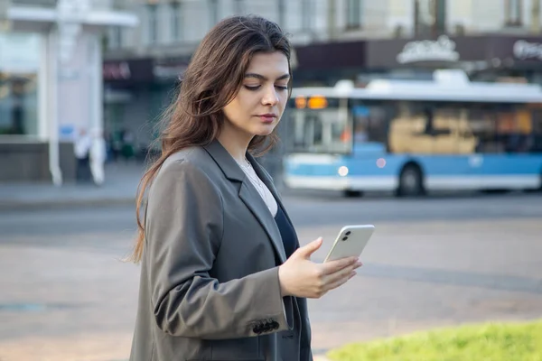 Business Young Woman Jacket Smartphone Blurred Background City — Foto de Stock