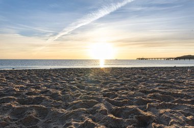 Embankment, seashore at sunset on a summer evening, natural background.