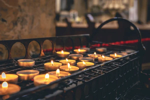 Many Small Candles Catholic Church Dark Interior —  Fotos de Stock