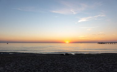 Embankment, seashore at sunset on a summer evening, natural background.